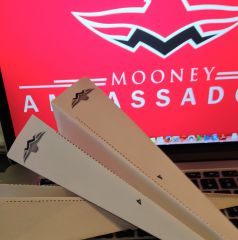 Our Ambassador children's paper airplane-making activity now includes Mooney logo.