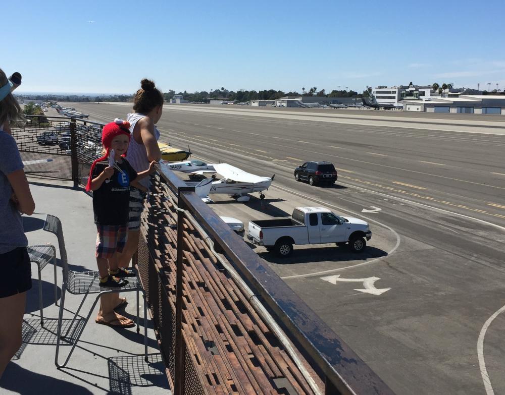 SMO - Boy with Airplane on Observation Deck.jpg