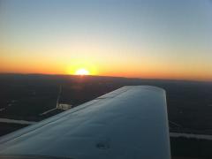 Sunset off the wingtip before descending into Sacramento Executive (KSAC).