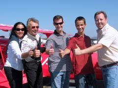 wife + son + friends posing with Aerobatic legend Sean D. Tucker