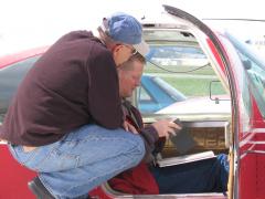 Les is sitting on the wing checking things out with our ferry pilot.