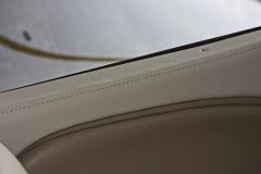 Interior window detail -French stitching. Window frames completely rebuilt with carbon fiber prior to being covered with leather
