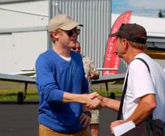 Mooney Ambassador founder Mitch Latting greet Jack Wiegand after his round the world trip in an Ovation