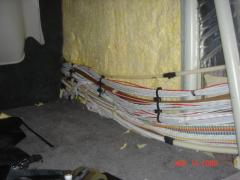 Wiring under side walls in cabin