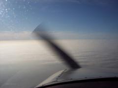 over kansas with soild cloud deck below