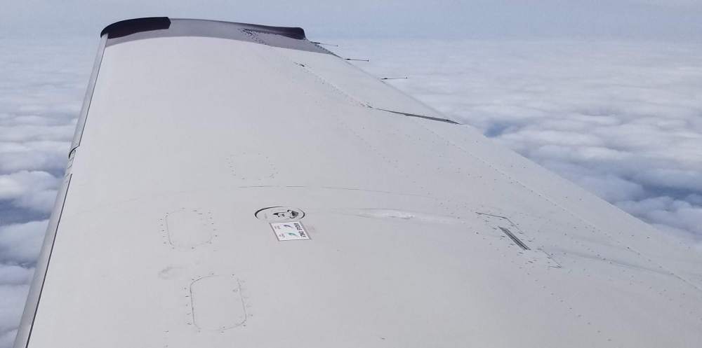 wing ice behind fuel cap.jpg